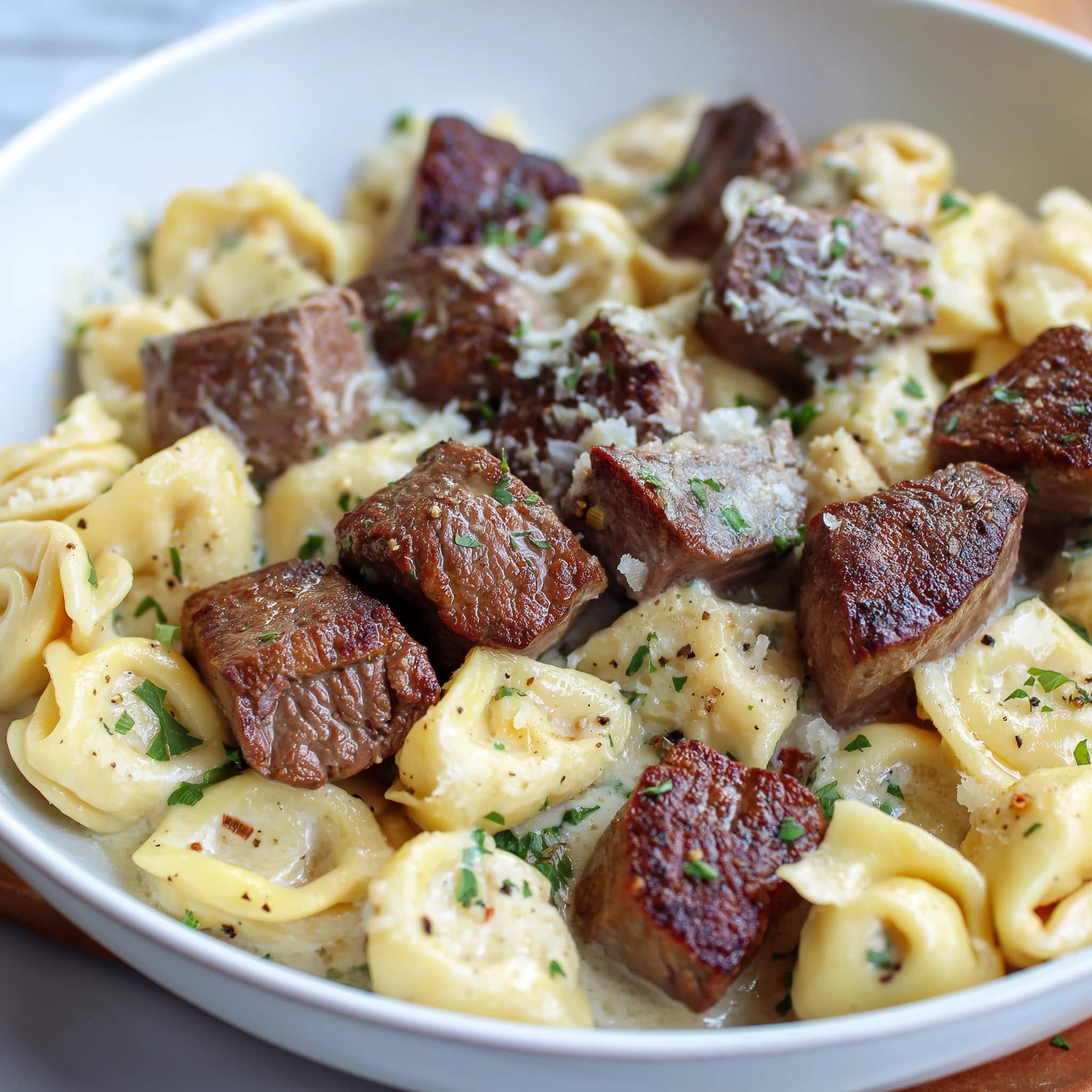 Steak Bites and Shell Pasta in Garlic Butter Alfredo Sauce Recipe - Recipe Image